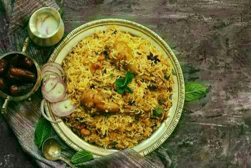 Adukukattu Biryani - Logo