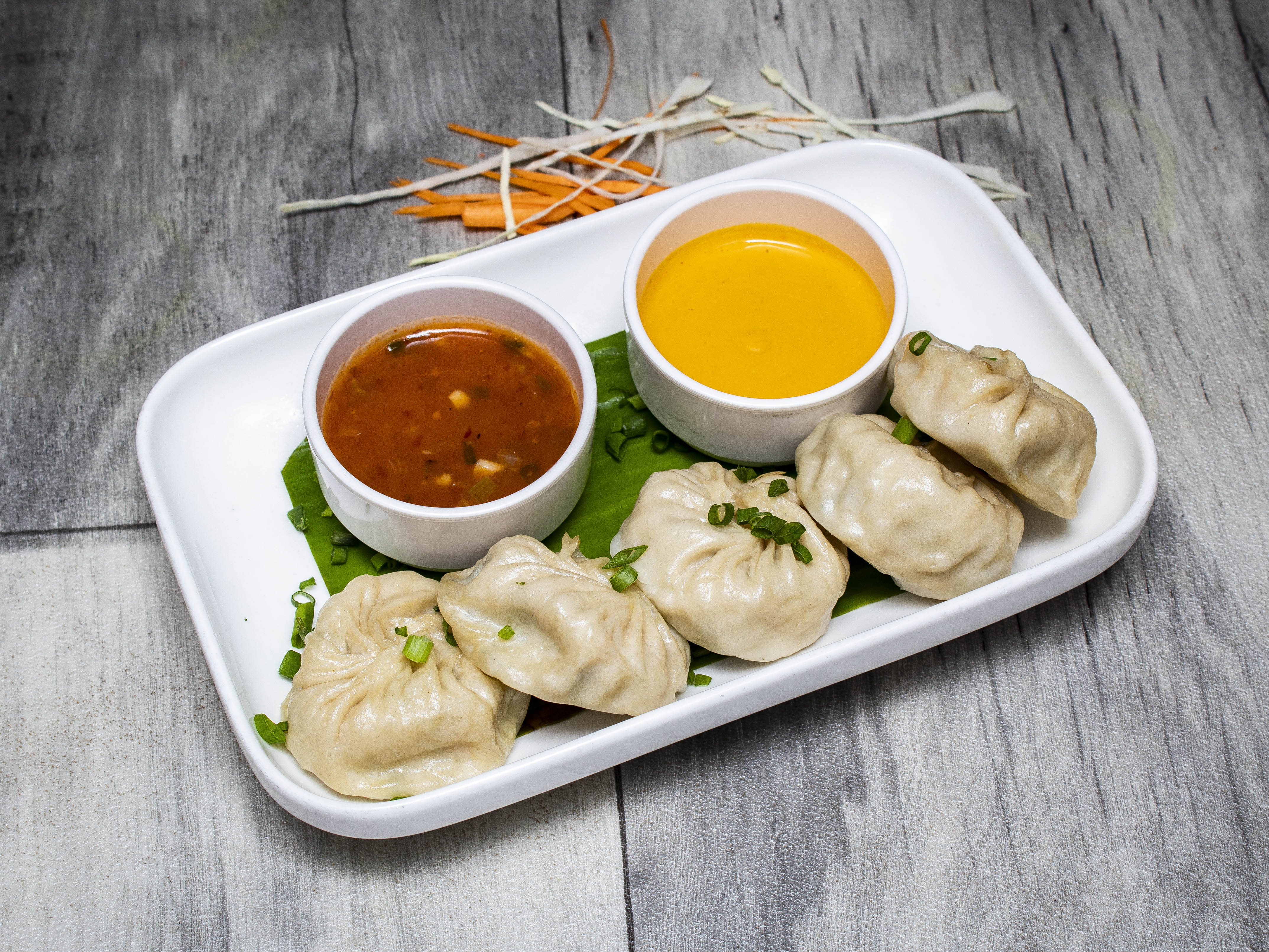 AJ Momos - Logo