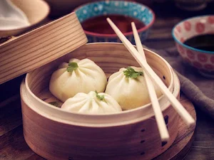Aman Momos - Logo