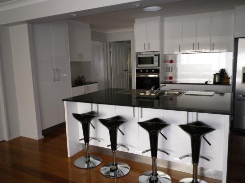 Custom Kitchens by Design - Logo