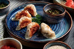 Delicious Momos And Chaap - Logo