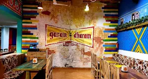 Dharam Garam Family Restaurant - Logo