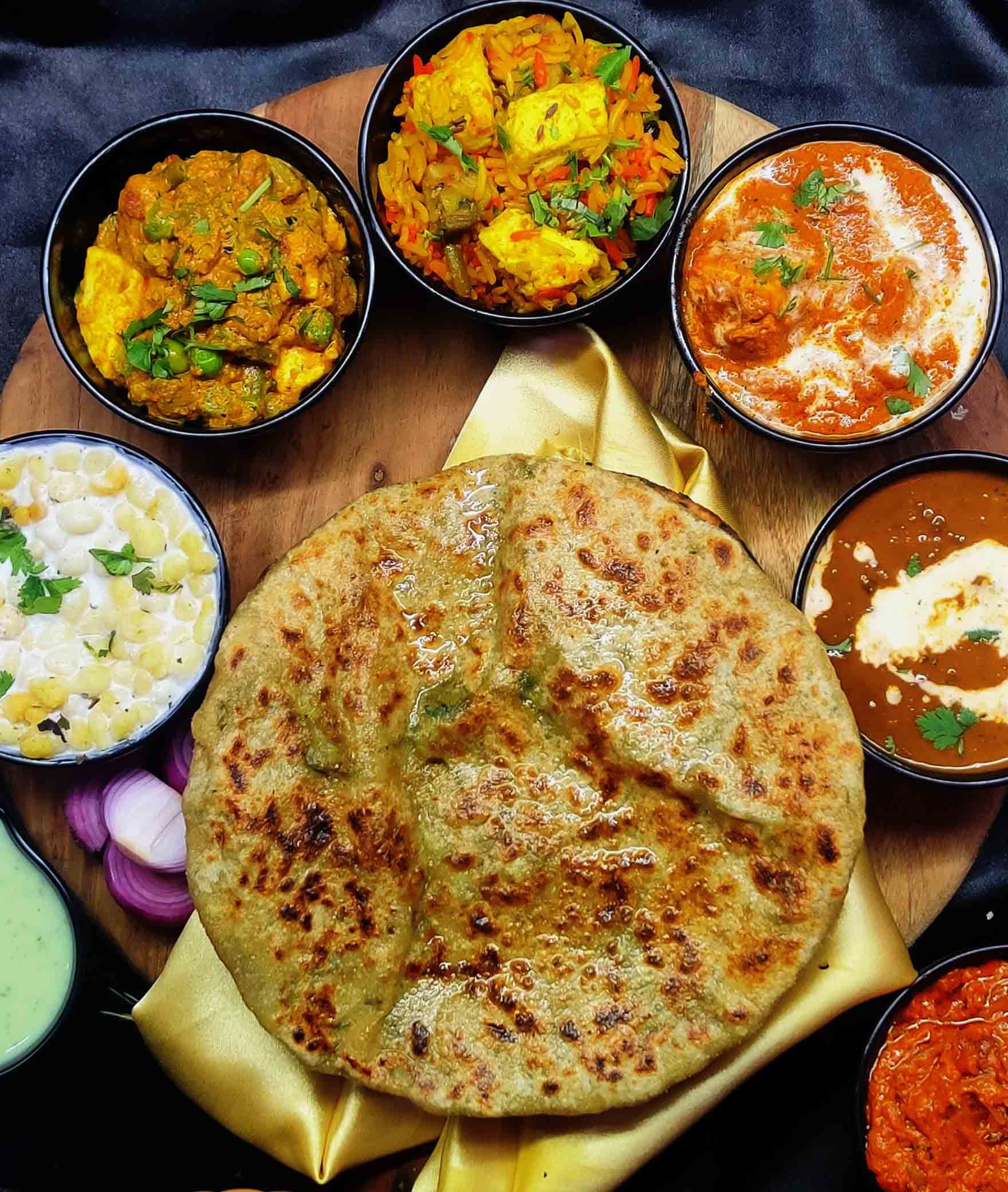 Dilli Tawa Parantha by Punjabi Angithi - Logo