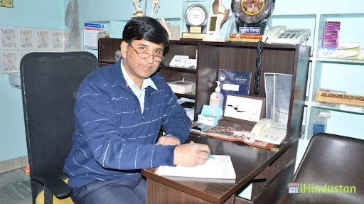 Dr. Kishore Raichandani - Logo