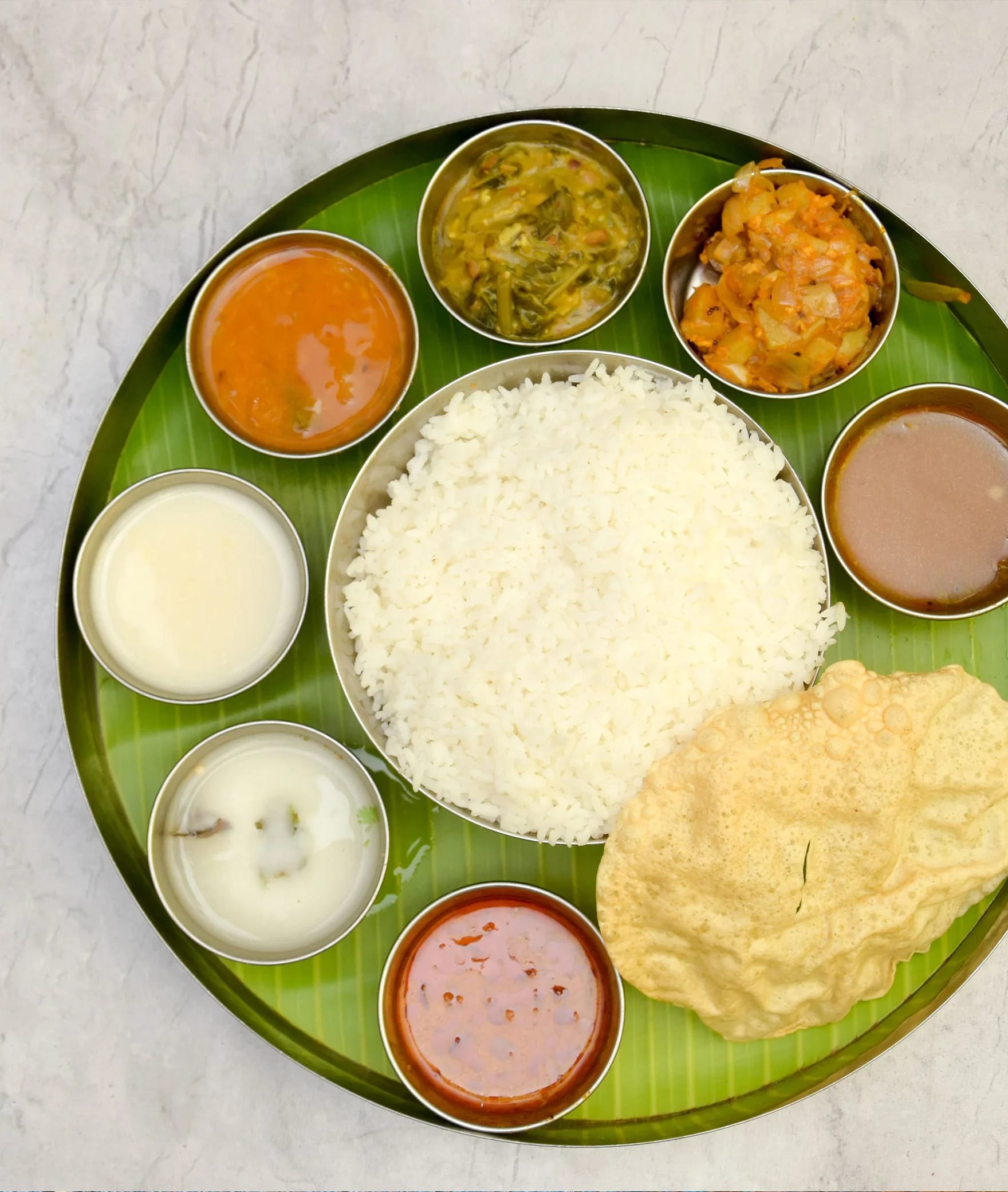 Gnanambiga Veg Restaurant - Logo
