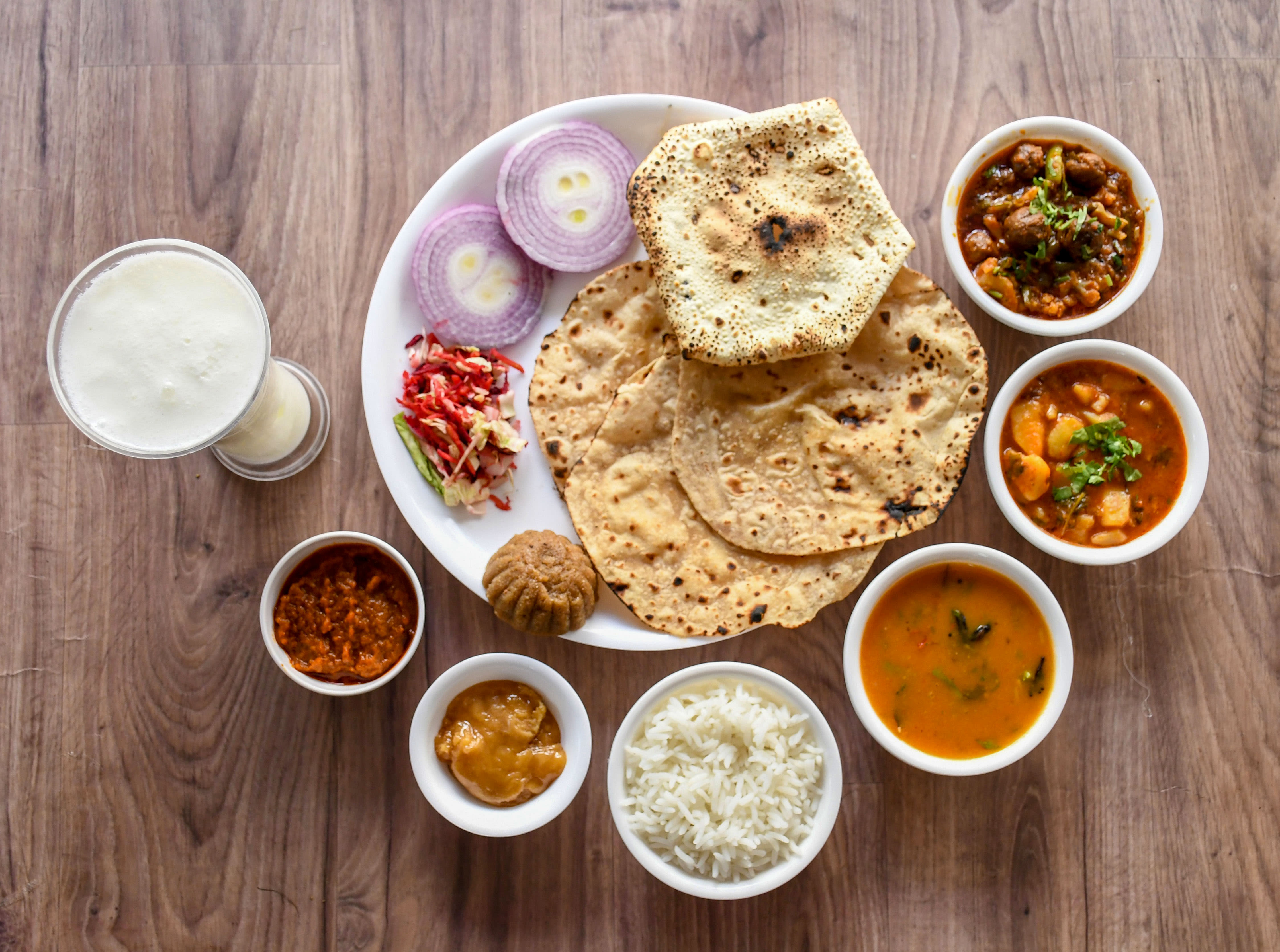 Gurudev Gujarati Thali And Snacks - Logo