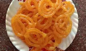 Haribhai Damodar & Sons Mithaiwala - Logo