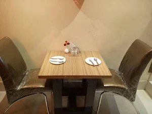 Ishan's Cafe & More - Logo