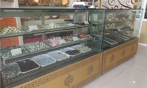 J Oberoi Sweets - Logo