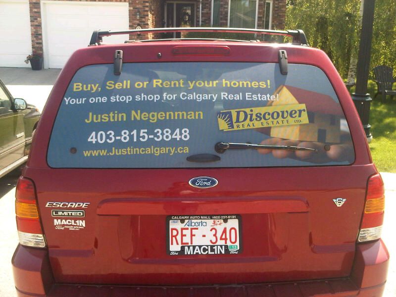 Justin Negenman - Discover Real Estate - Logo