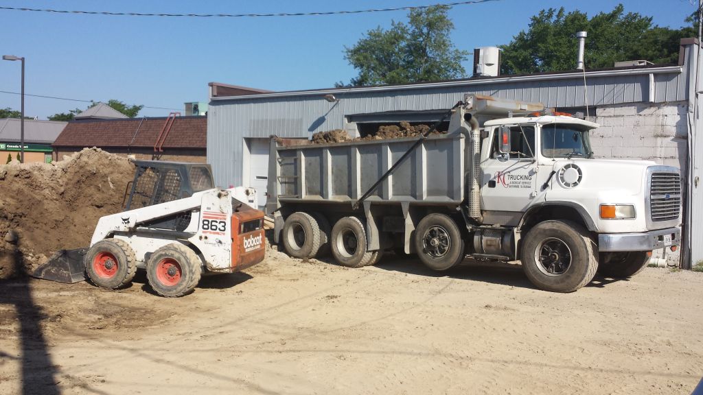 KC Trucking and Bobcat Service - Logo