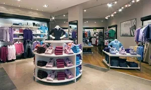 K.Poonam Cloth Centre - Logo