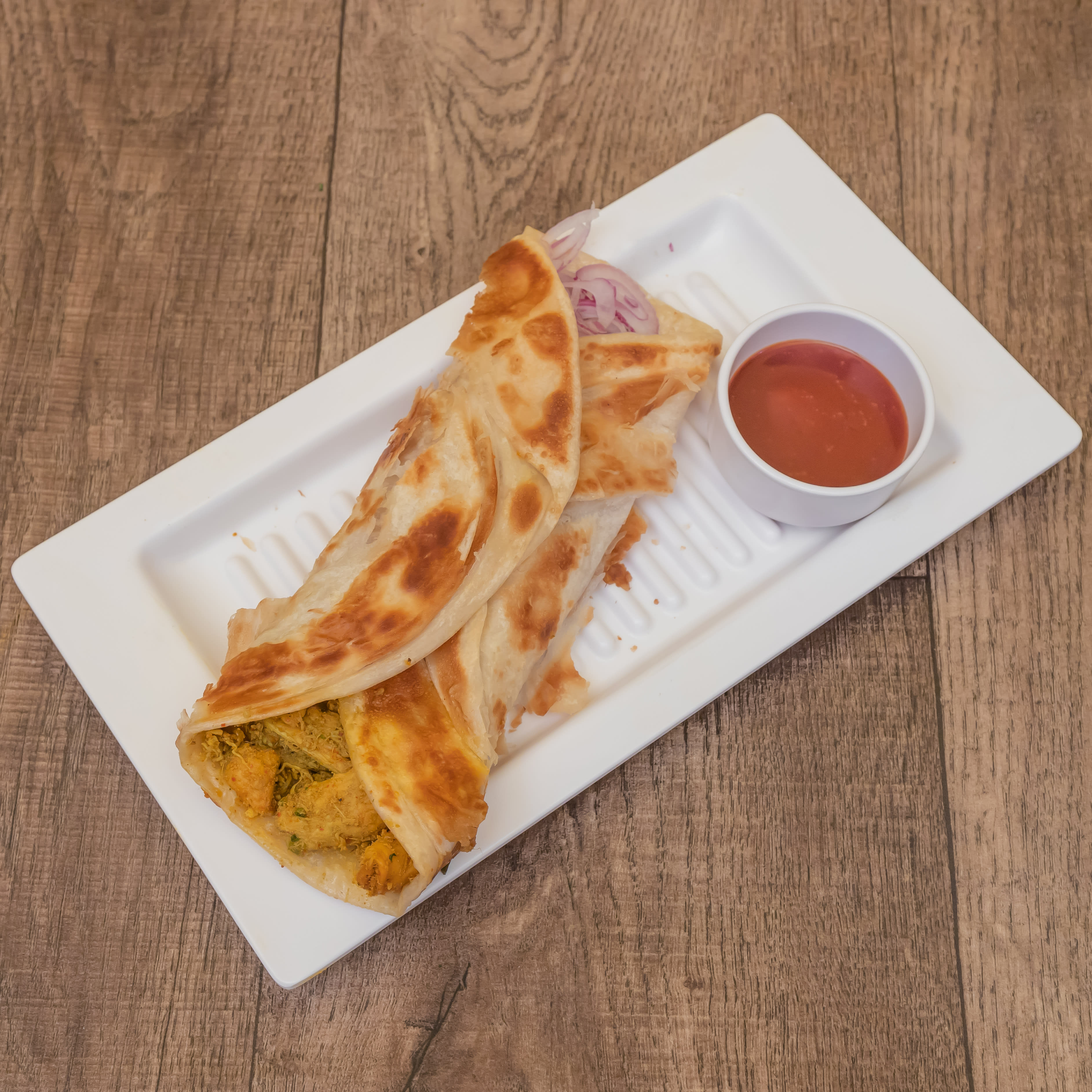 Lazeez Kathi Roll By Tadka - Logo