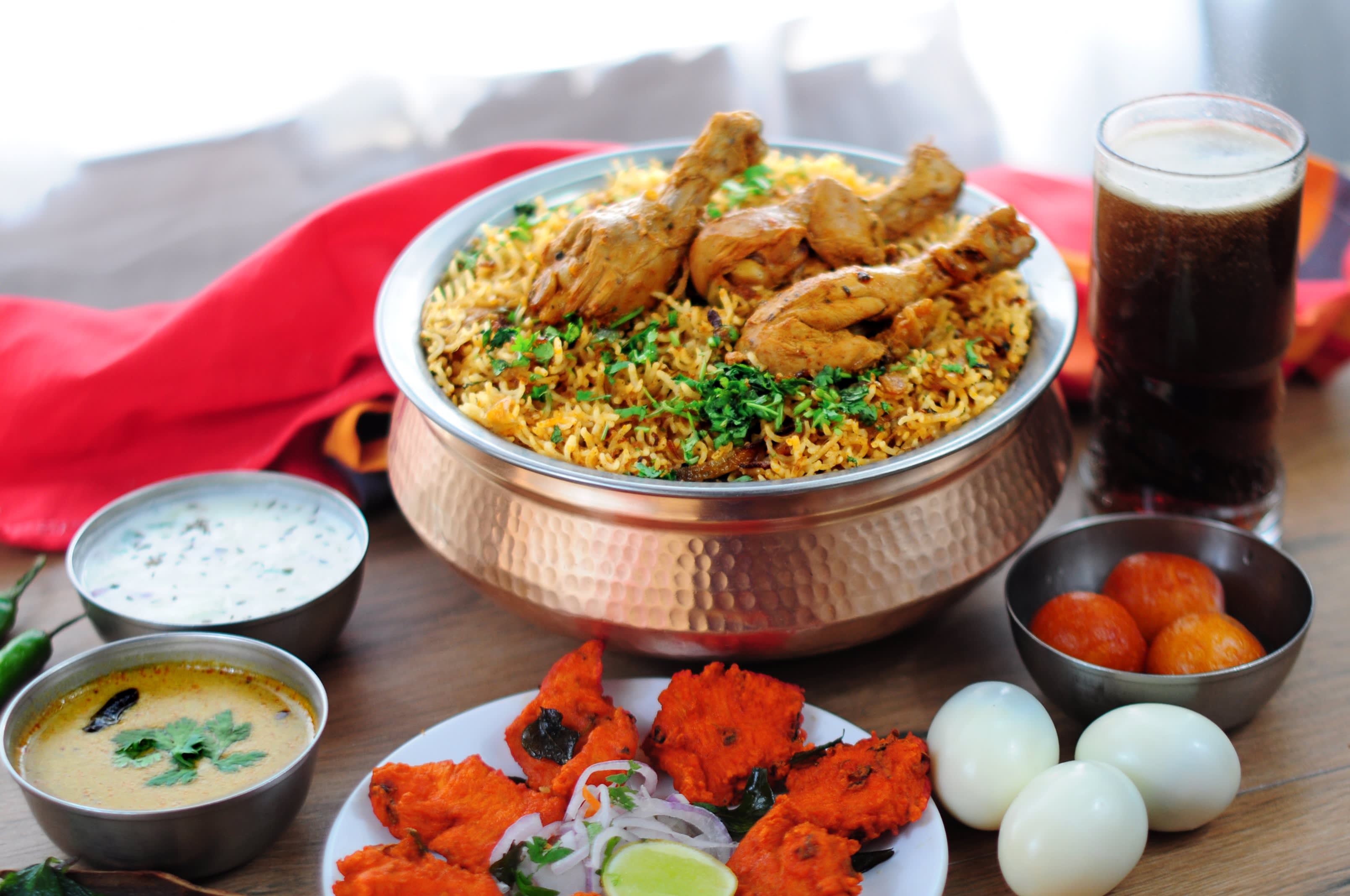 Mani's Dum Biryani - Logo
