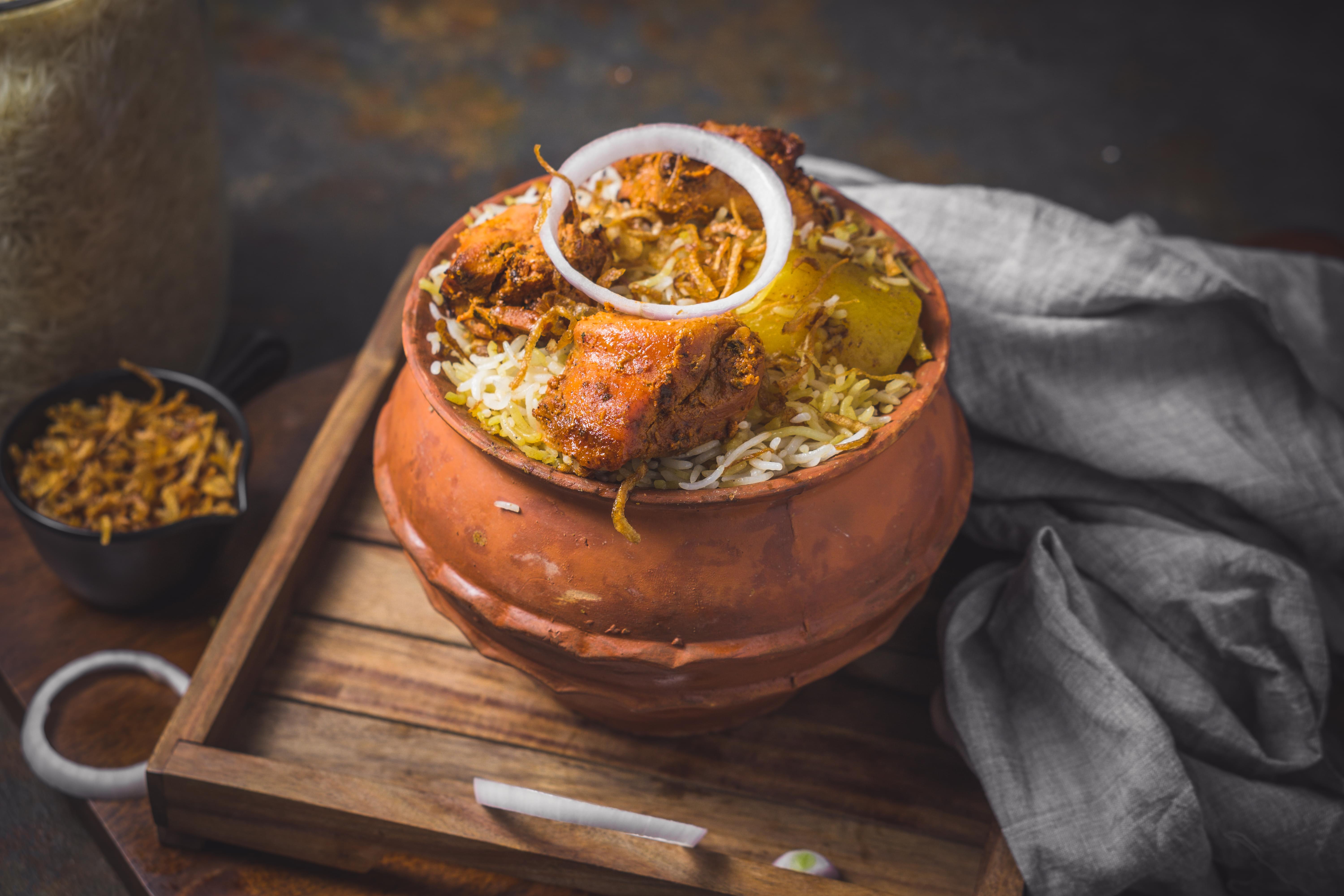 M B Biryani House - Logo