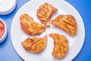 Momos Delight - Logo