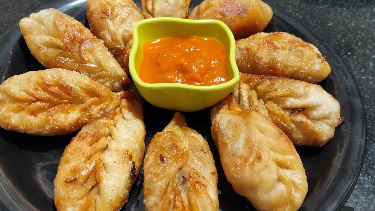 Momos Eatery - Logo