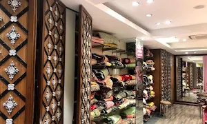 Mulchand Cloth Corner - Logo