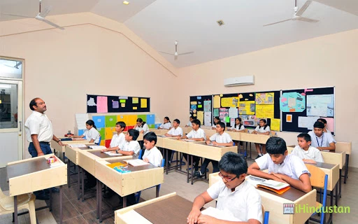N.H. GOEL WORLD SCHOOL - Logo