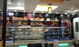 Nithya Amirtham Sweets - Logo