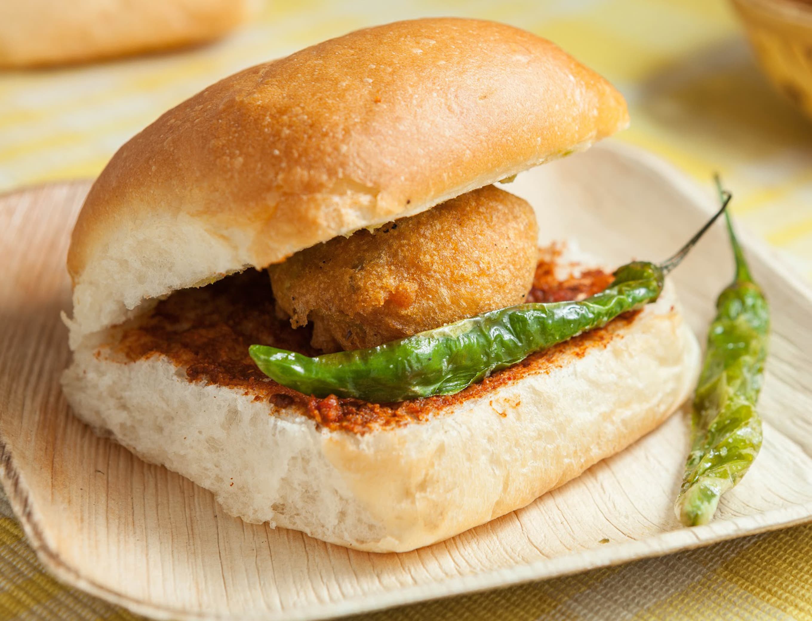 Poornima Vada Pav - Logo