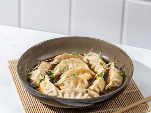 Prasuma Momo Kitchen - Logo