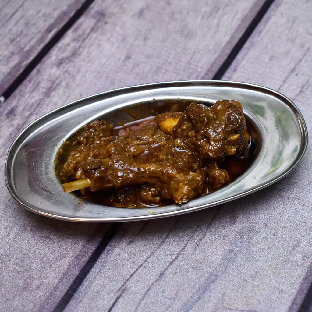 Purvi Champaran Meat House - Logo