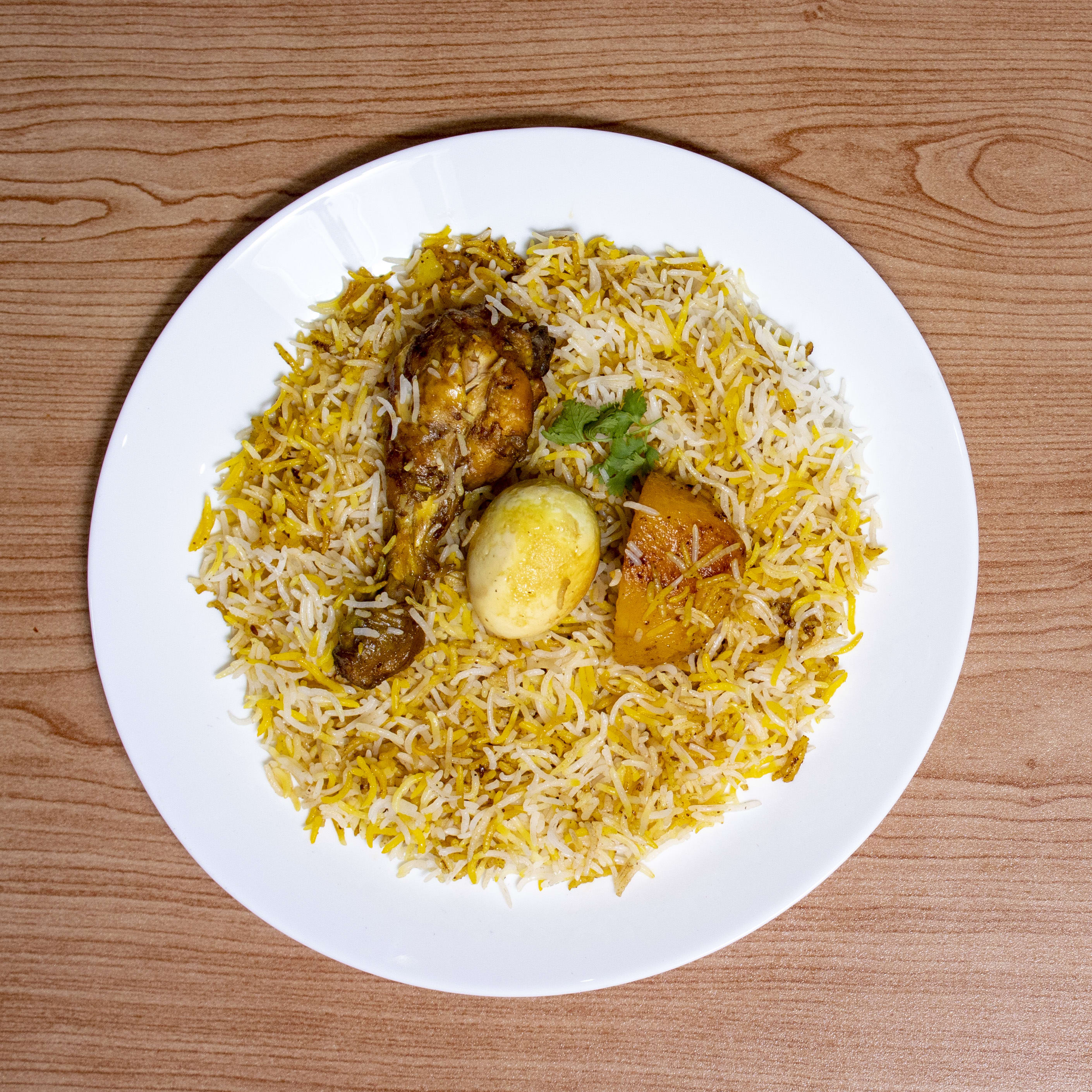 Quadri Chicken Biryani - Logo