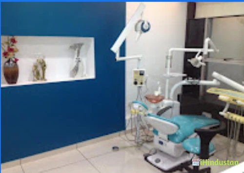 Raksha Dental Clinic & Implant Centre - Logo