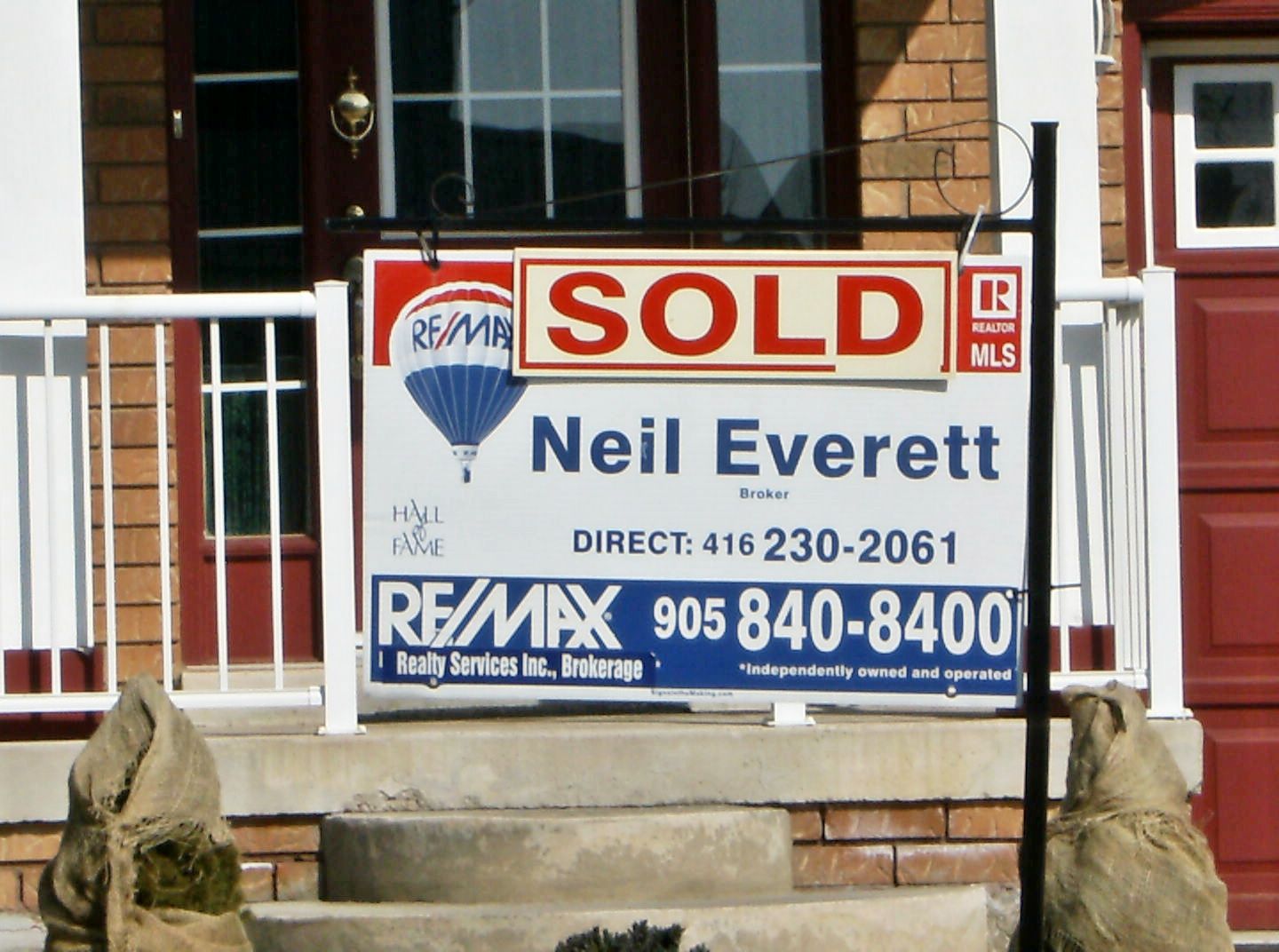 Re/Max Realty Services Inc. Brokerage - Neil Evere - Logo