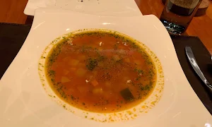 Romano's - JW Marriott Sahar - Logo
