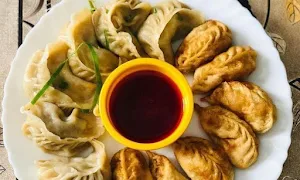 Seven Carnival Momos - Logo