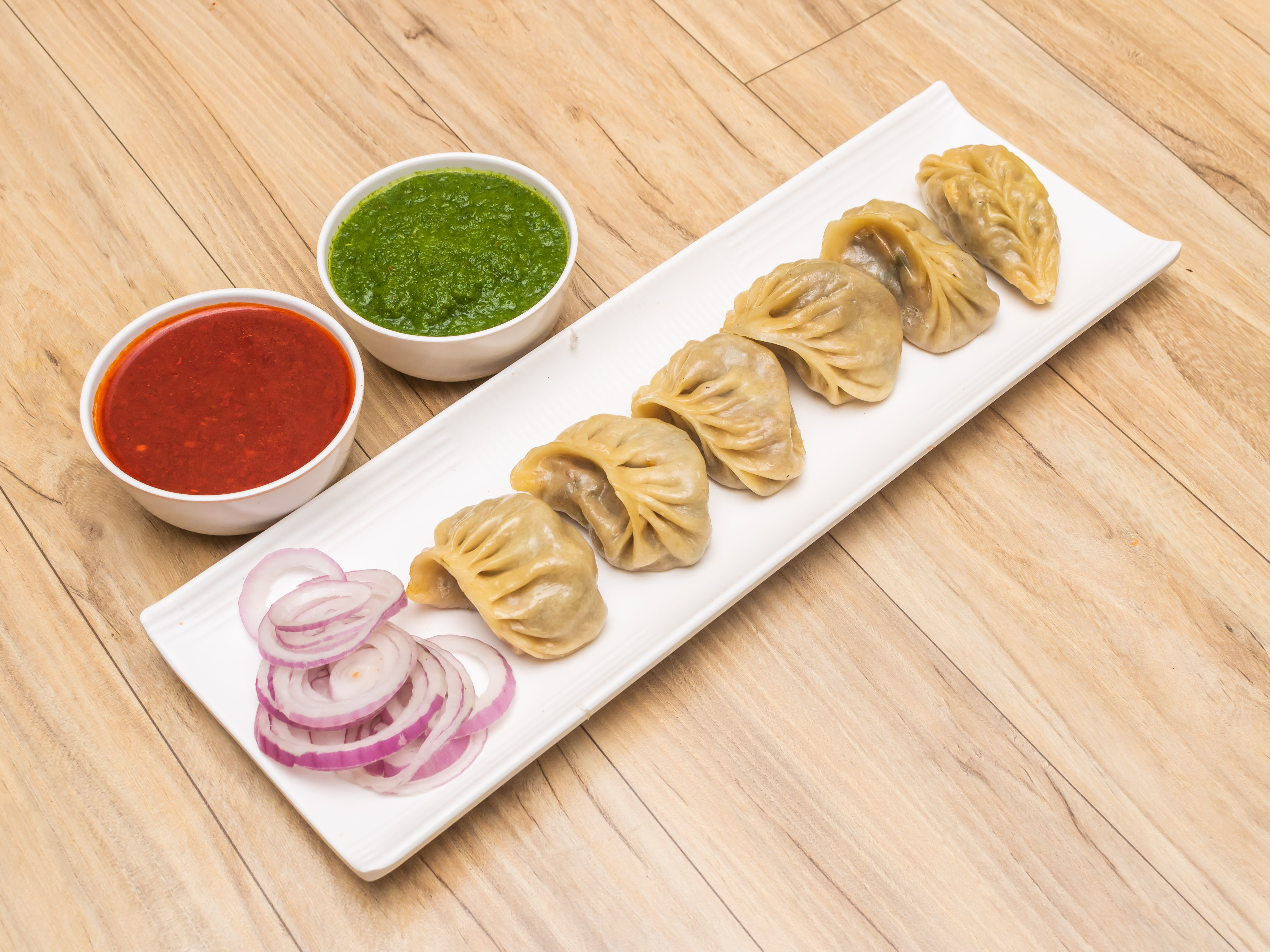 Seven Carnival Momos - Logo