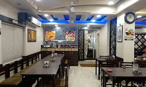 Shruti Veg Restaurant - Logo