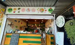 Simi's World Vegan Cafe - Logo