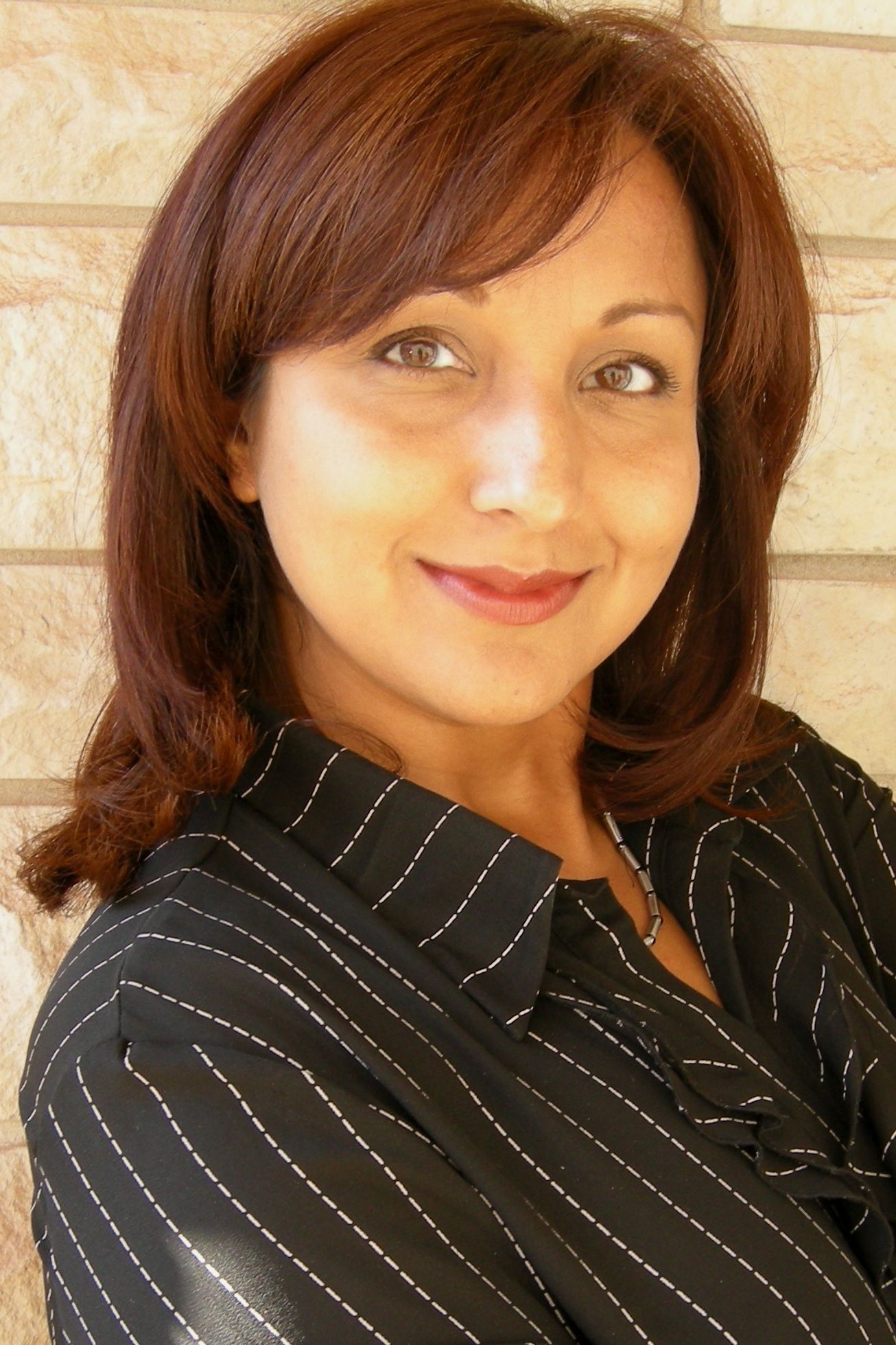 Sonia Jain-RE/MAX REALTY SPECIALISTS INC - Logo