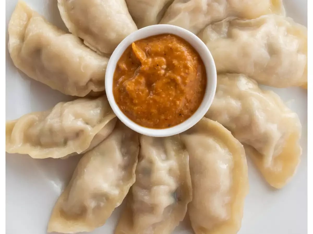 Spicy Momos And Kathi Roll - Logo