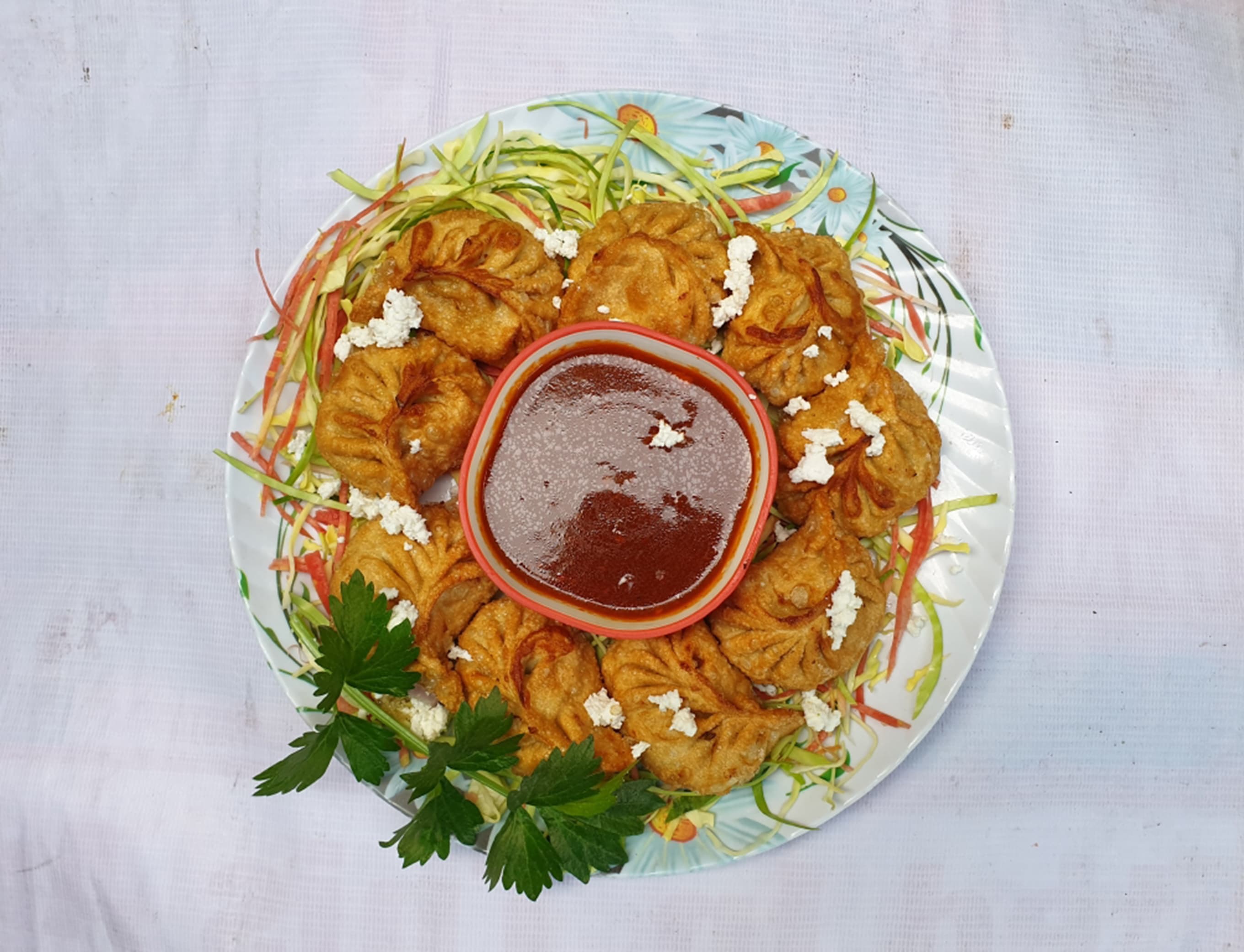 S p momos - Logo