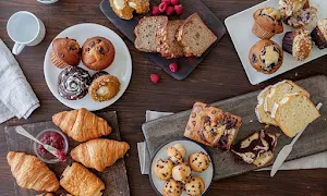 Sri Nanjundeshwara Bakery And Sweets - Logo
