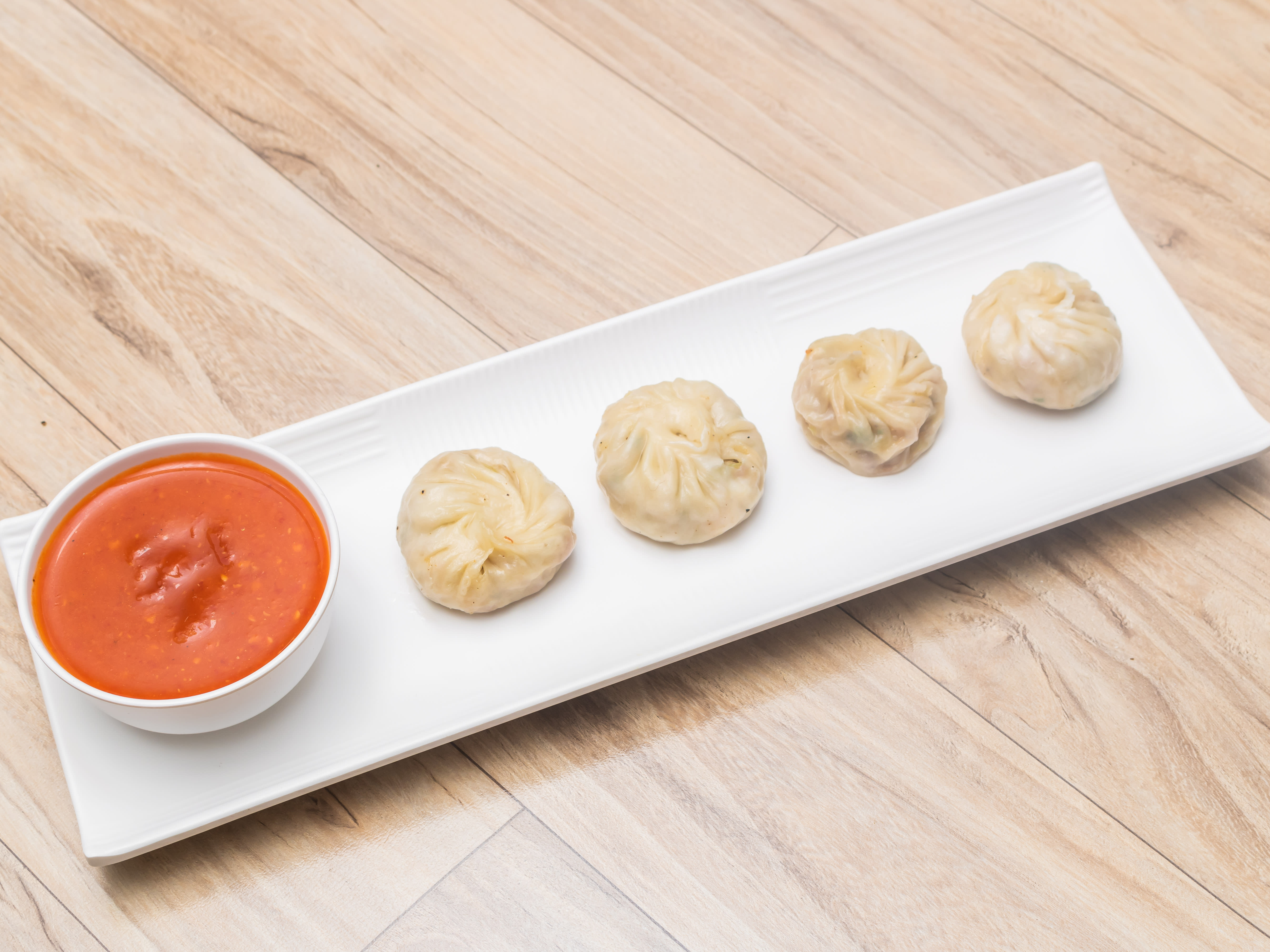 Suraj Lama Momos - Logo