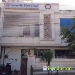 Swastik Hospital + - Logo