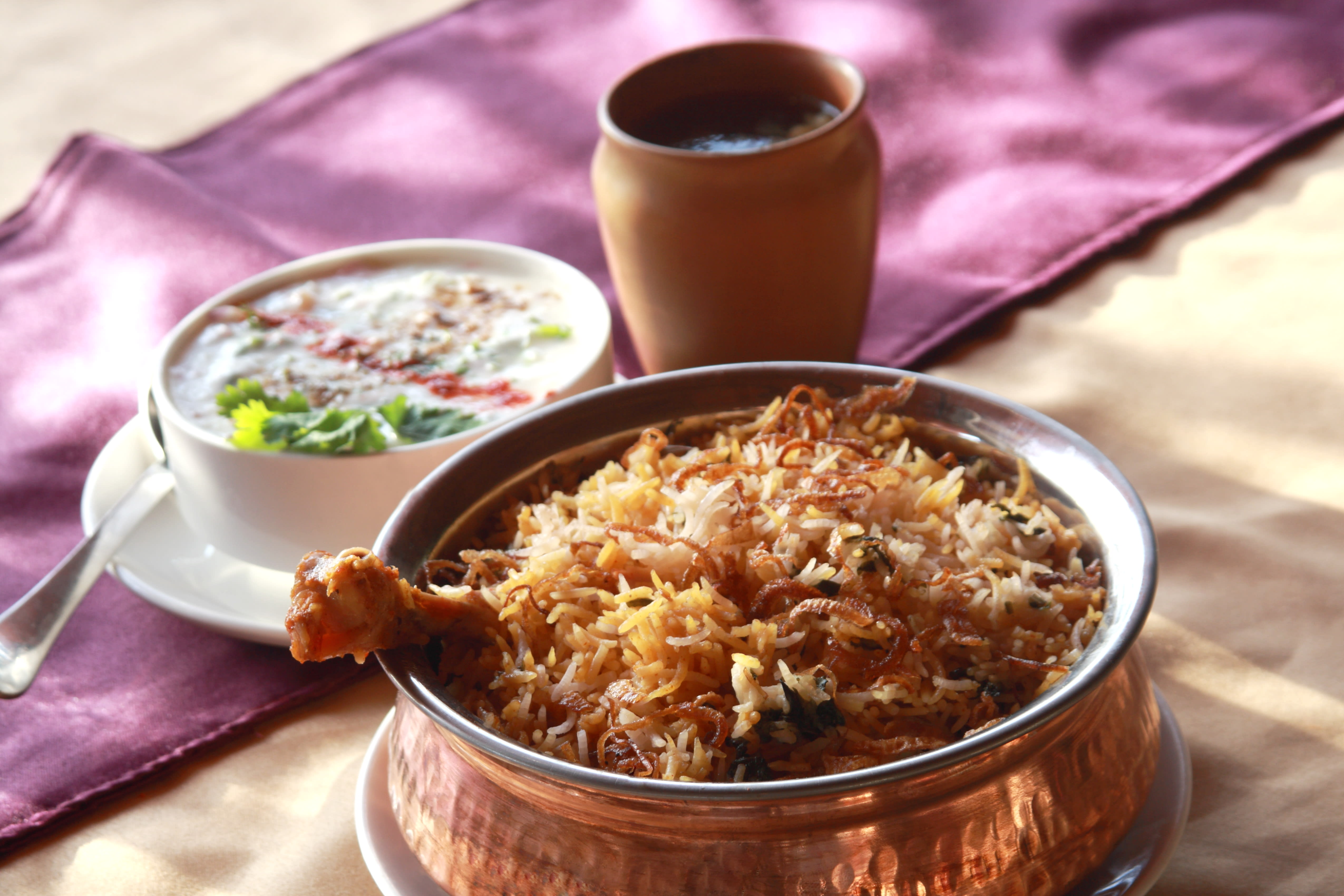 Taj Thalapakattu Biryani - Logo