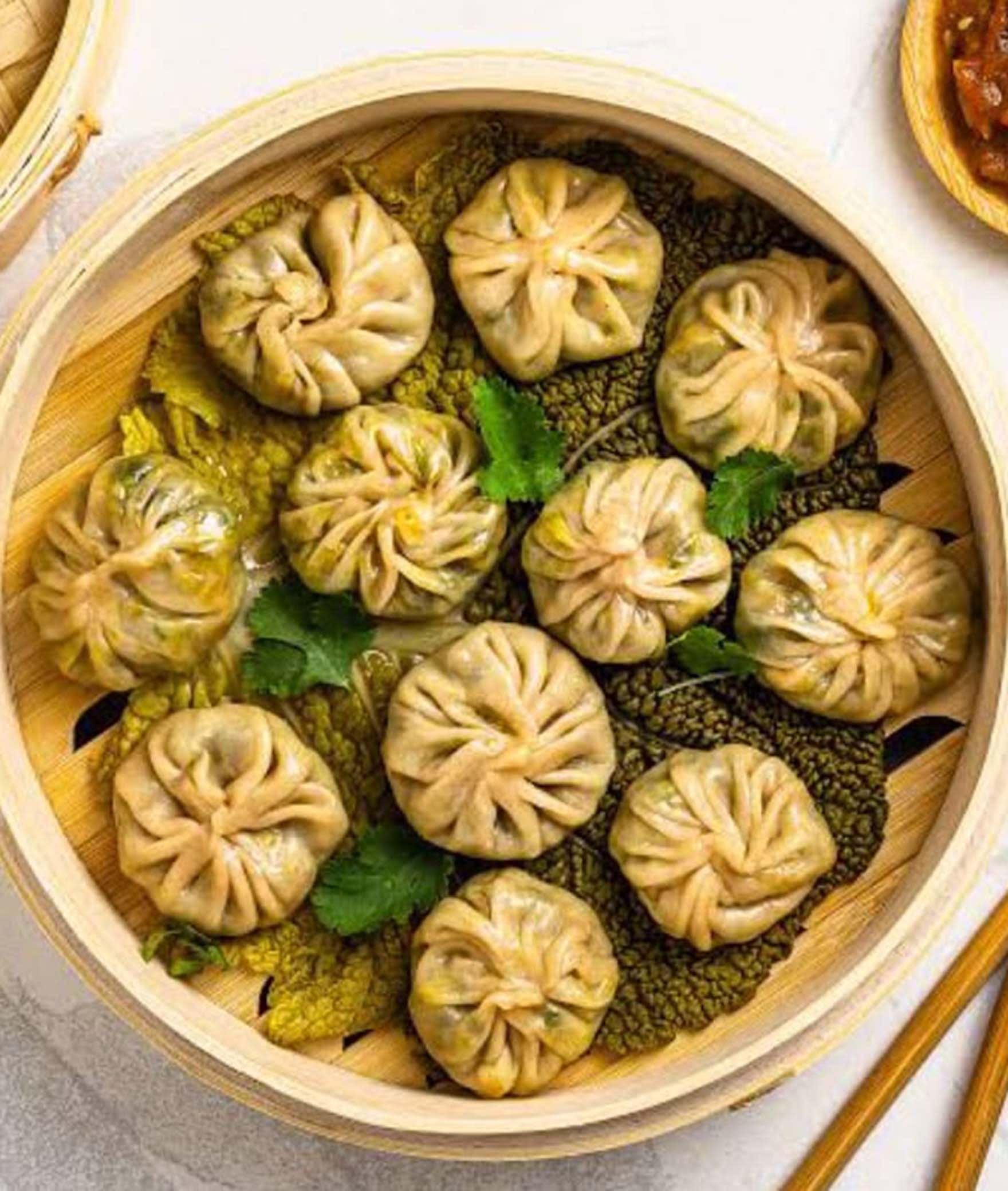 Tastium Momos - Logo