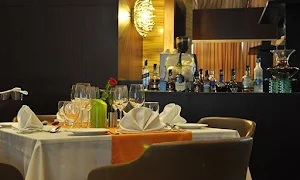 Tatva - Country Inn & Suites - Logo
