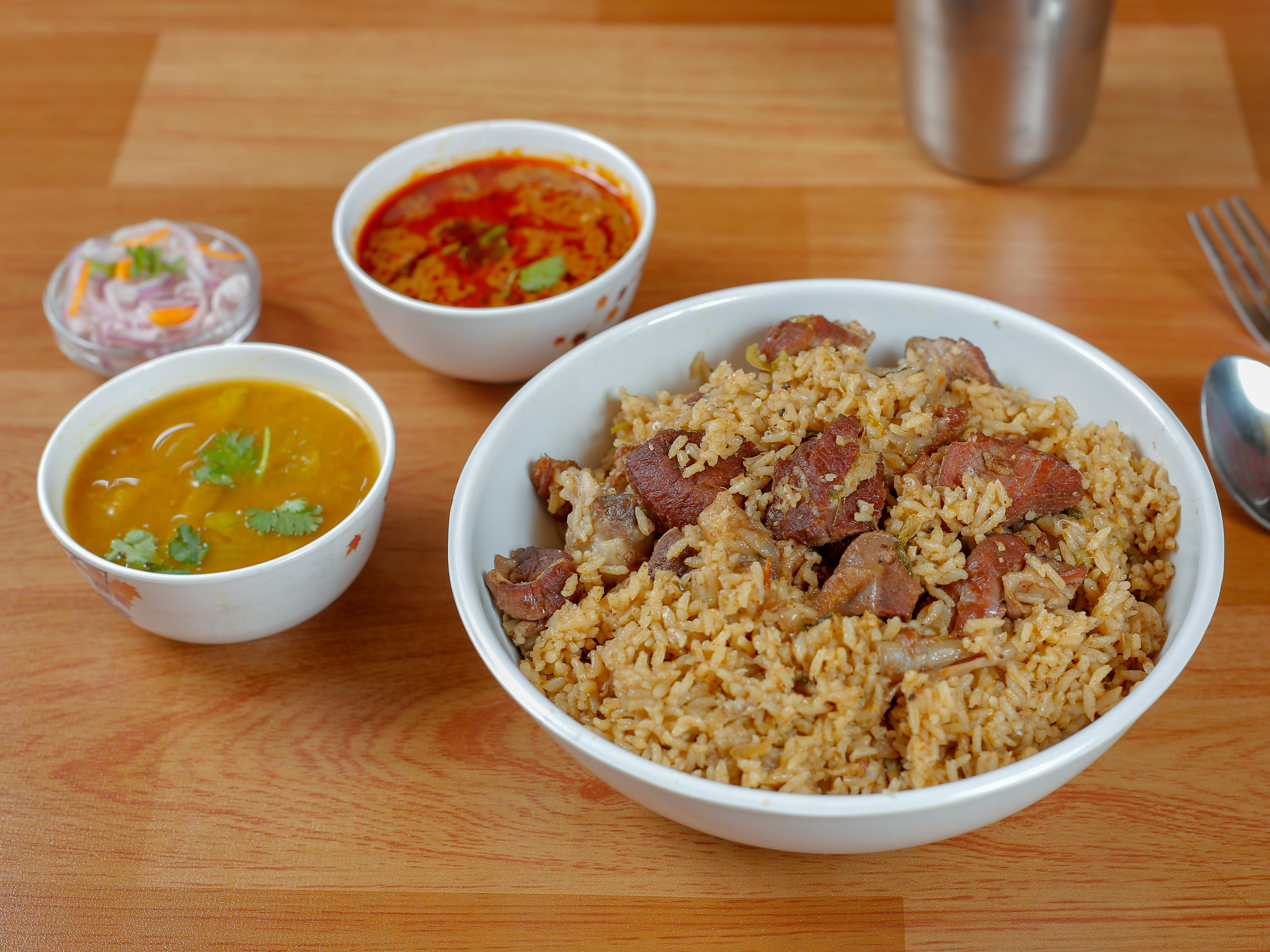 Thambis Biriyani - Logo