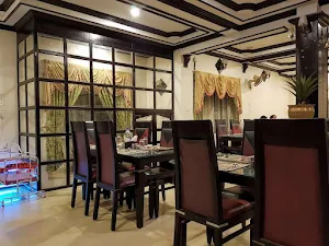 Tharavattil Plaza Multicuisine Restaurant - Logo