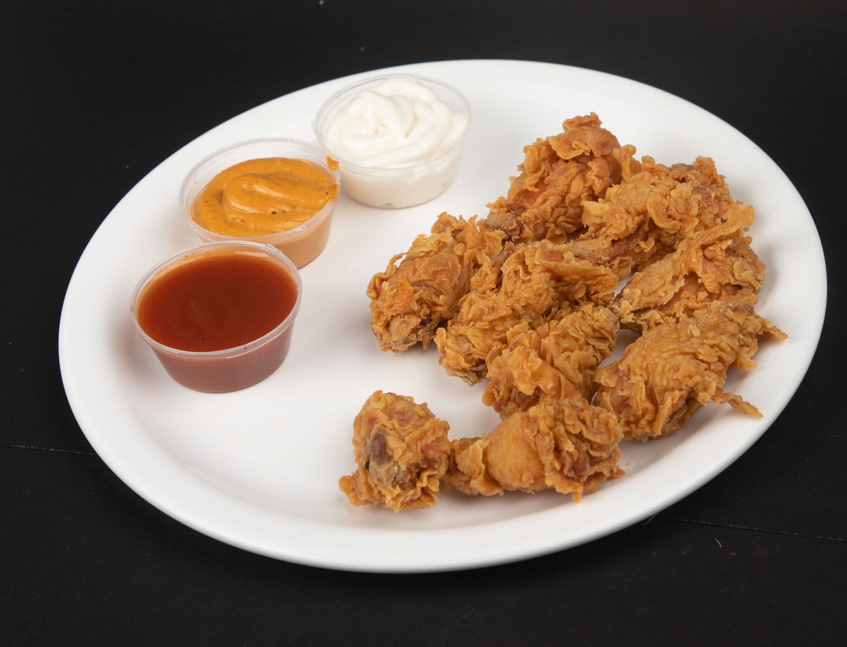 The Egg Stop and Mexicos Chicken Poppers - Logo