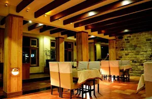 The Yellow Table - Landmark Hotel - Cover photo