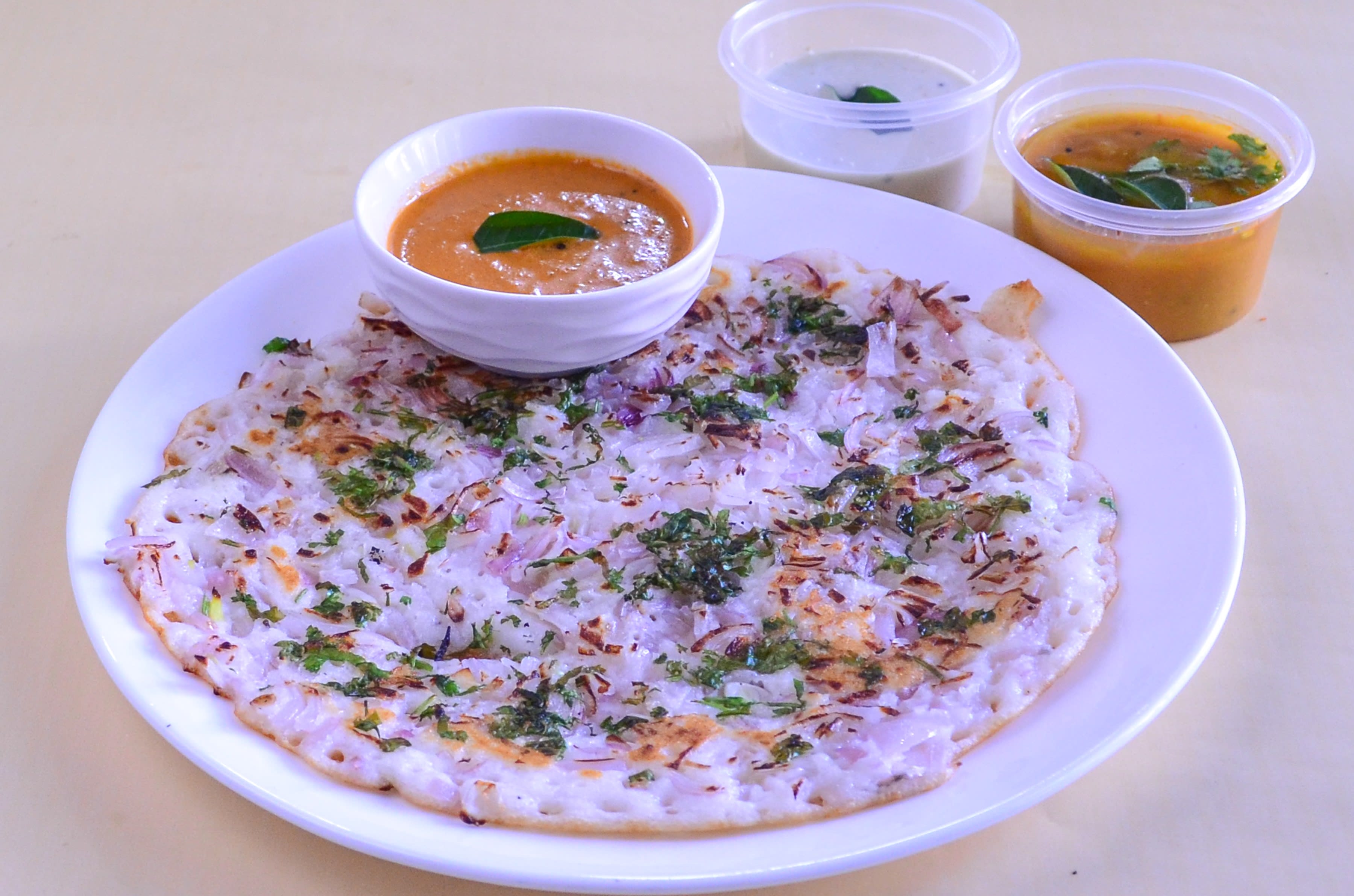 Uttar Dakshin Cafe And Restaurant - Logo