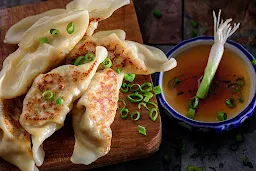 Veggie Momo Treats - Logo